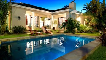 Outdoor pool, open 7:00 AM to 10:00 PM, pool loungers
