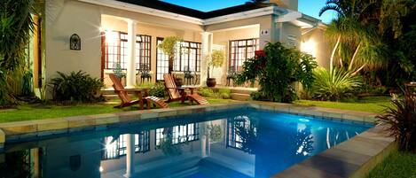 Outdoor pool, open 7:00 AM to 10:00 PM, pool loungers