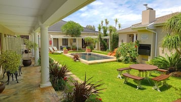 Outdoor pool, open 7:00 AM to 10:00 PM, pool loungers