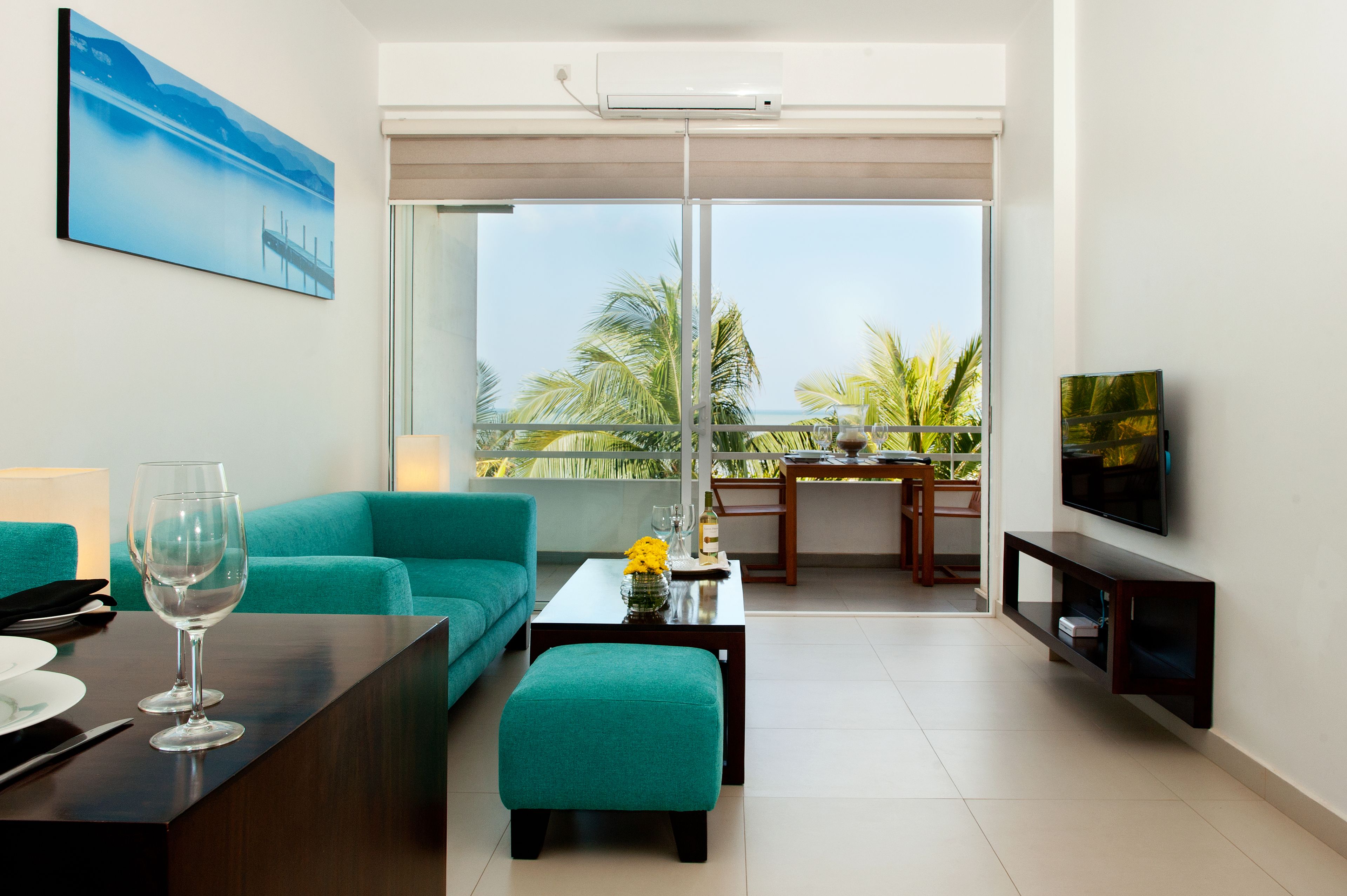 luxury apartment, 1 bedroom, sea view, beachfront | living area | 40-inch lcd tv with satellite channels, tv