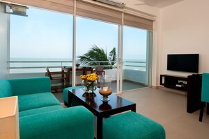 Luxury Apartment, 2 Bedrooms, Connecting Rooms, Beachfront | Living area | 40-inch LCD TV with satellite channels, TV