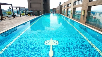 Seasonal outdoor pool, pool loungers