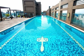Seasonal outdoor pool, pool loungers