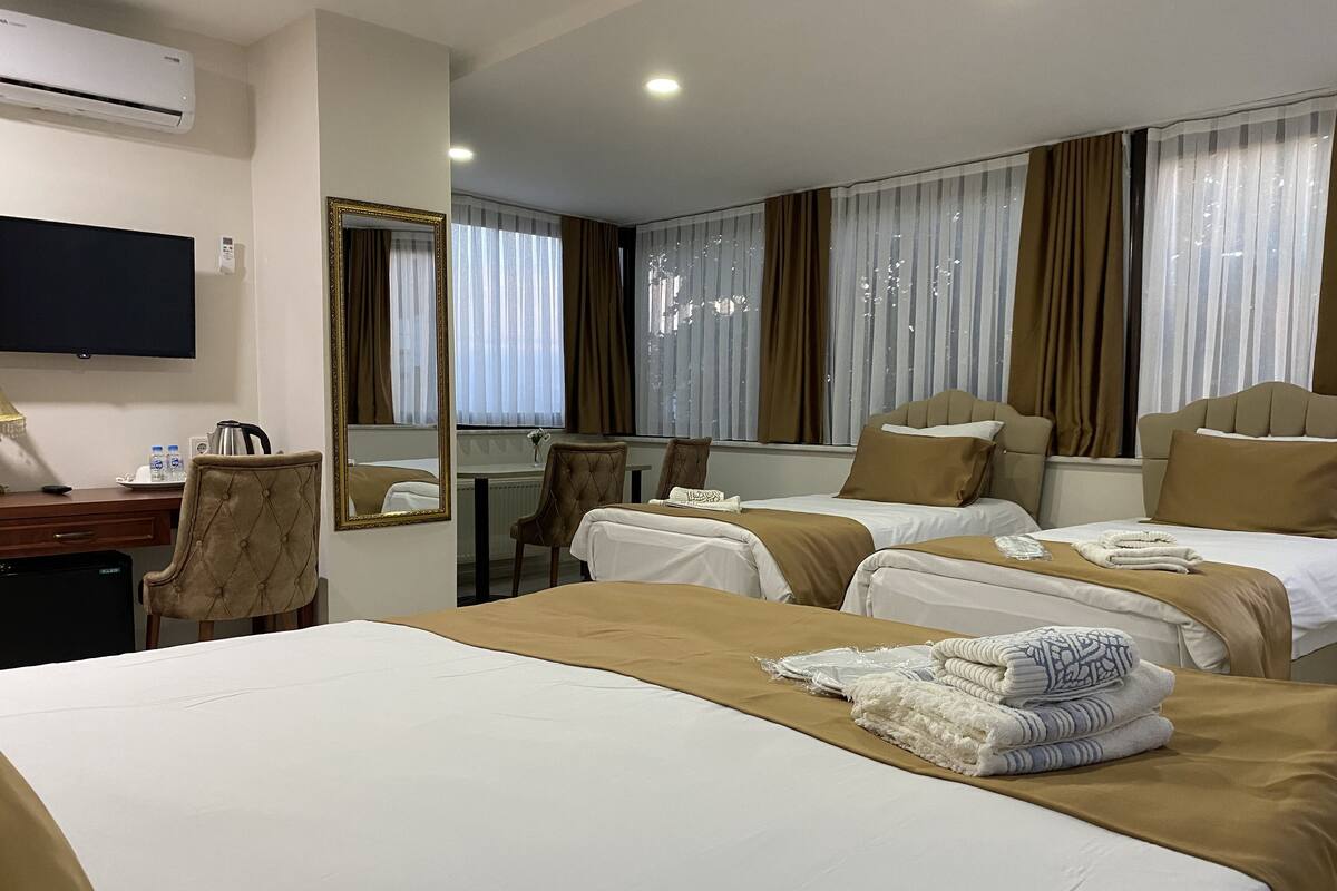 Chambre Quadruple Panoramique | Literie de qualité supérieure, minibar, coffres-forts dans les chambres