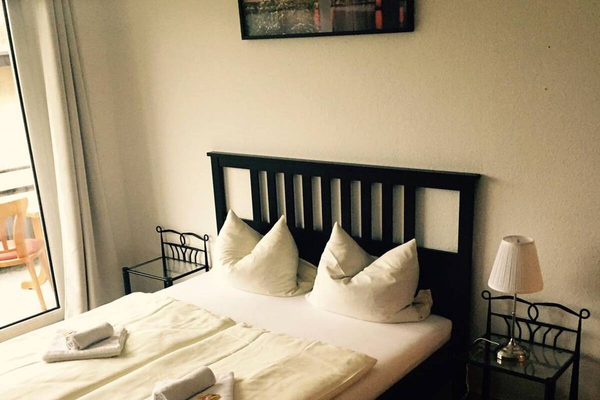 Habitación doble, baño compartido | Cunas gratuitas, camas extra, wifi gratis y ropa de cama