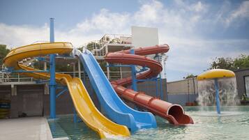 Enjoy thrilling water slides and a refreshing pool surrounded by a lively fountain.