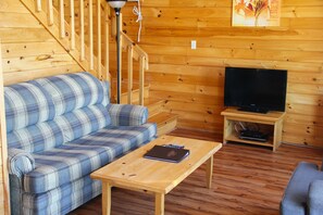 Executive Cottage, 2 Bedrooms, Partial Ocean View (1 Sofa Bed) | Living room | TV, fireplace, DVD player, table tennis - Swept Away Cottages (Bayview)