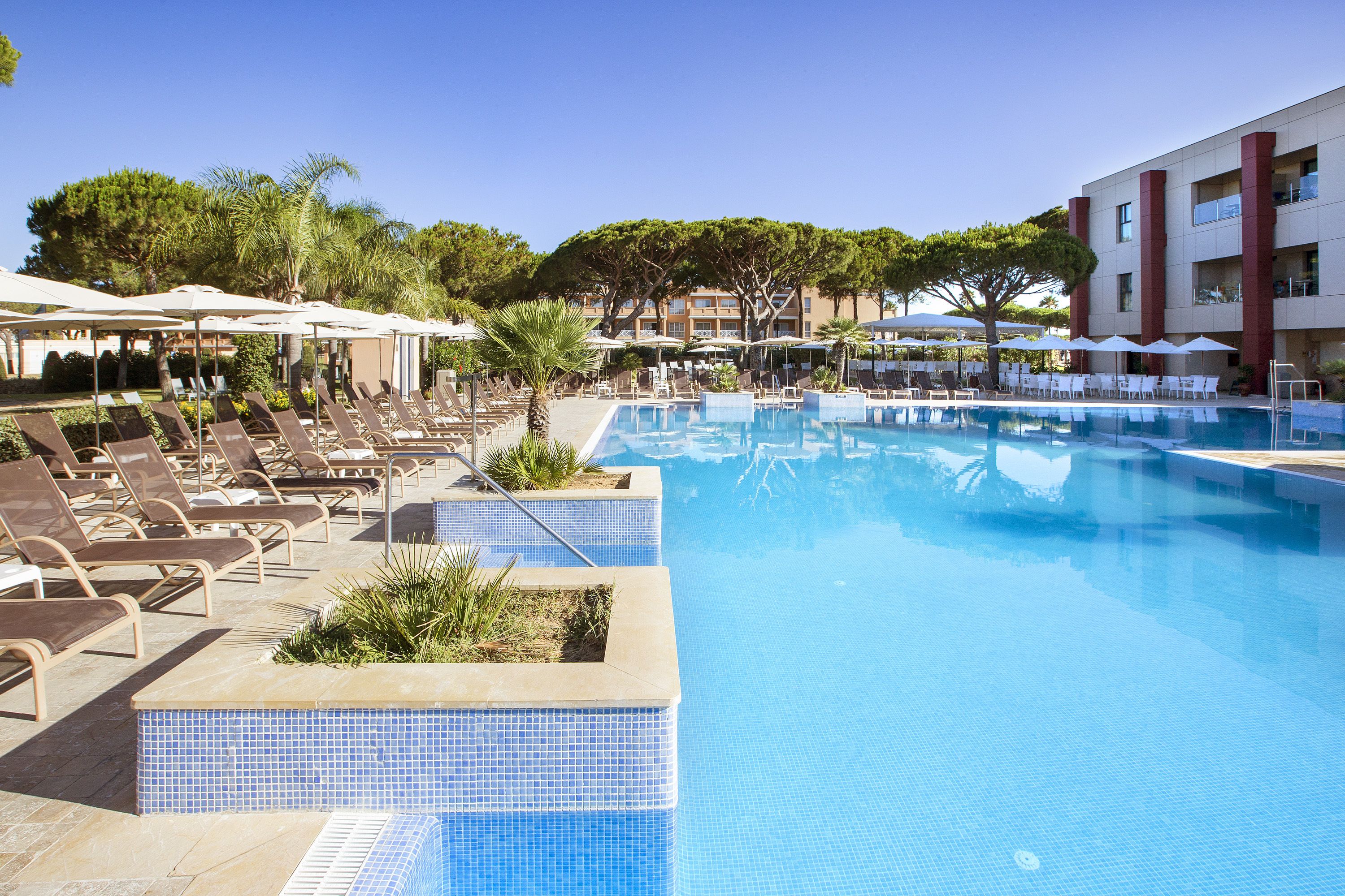 indoor pool, 2 outdoor pools, pool umbrellas, pool loungers