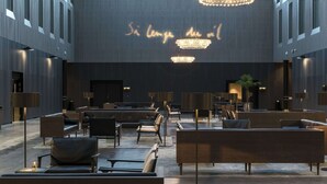A spacious lobby with modern seating arrangements and ambient lighting. - Clarion Hotel Air (Sola)
