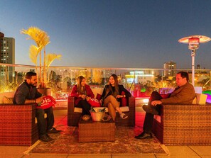 Guests can enjoy a rooftop view of the city from this outdoor space.