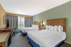 A hotel room with two beds, a desk, a chair, a television, and a window with curtains. - Hampton Inn & Suites Fort Mill (Fort Mill)