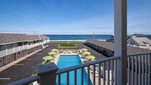 A motel with a pool, outdoor seating, and ocean views. -  Ocean Sands at York Beach (York Beach)