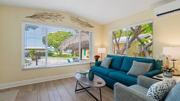 Cottage, 1 Queen Bed with Sofa bed, Kitchen (#06 Poolside with Tiki Hut) | Living area | 50-inch Smart TV with cable channels, TV