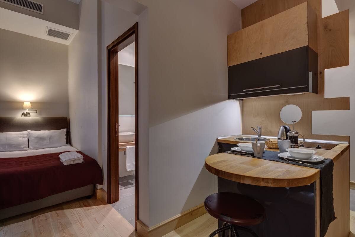 Suite Room with Kitchenette | In-room safe, desk, blackout drapes, soundproofing