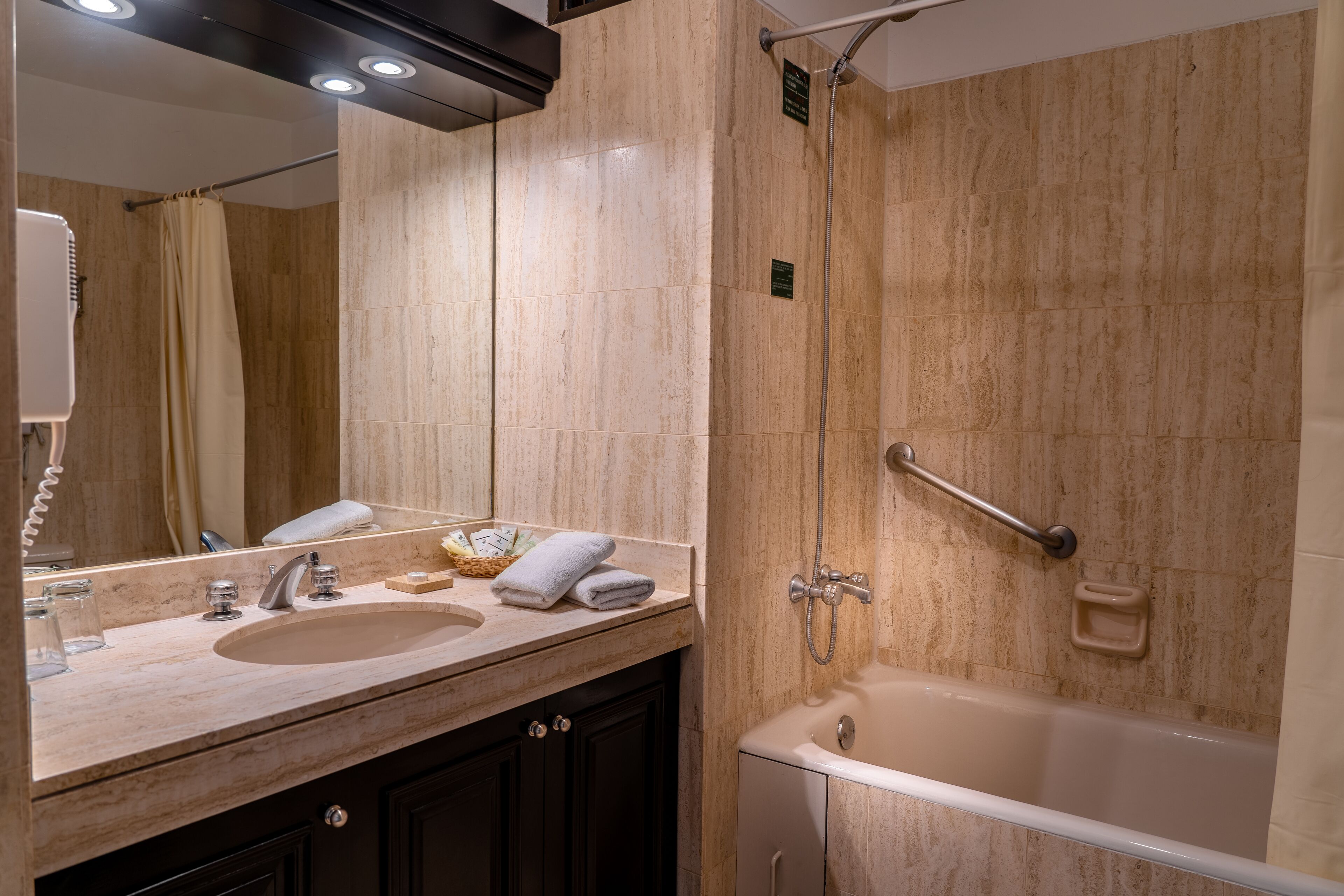 combined shower/bathtub, free toiletries, hair dryer, towels