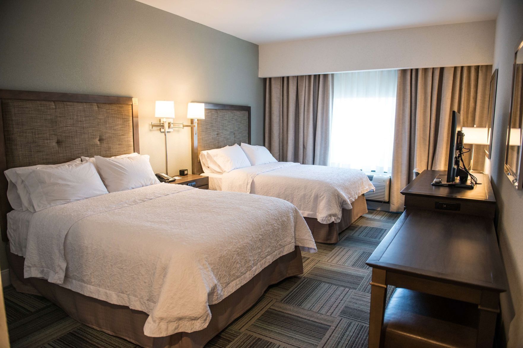 Down duvets, pillow-top beds, in-room safe, blackout curtains