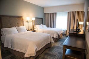 Down comforters, pillowtop beds, in-room safe, blackout drapes