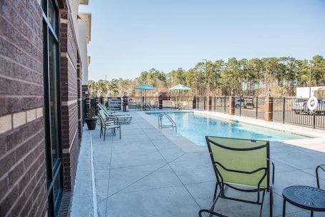 Outdoor pool, open 7 AM to 10 PM, pool umbrellas, sun loungers