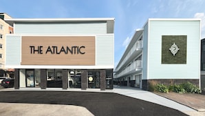 A modern building with a prominent sign reading "THE ATLANTIC". - The Atlantic, BW Signature Collection (Ocean City)