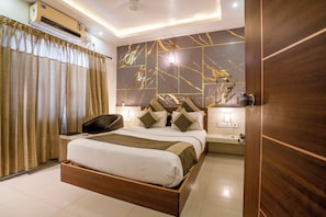 Premium bedding, pillowtop beds, in-room safe, individually furnished - Aishwarya Suites (Mysore)