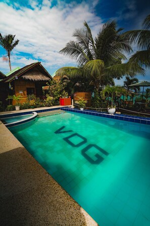 2 outdoor pools, open 9:00 AM to 8:00 PM, pool umbrellas, pool loungers