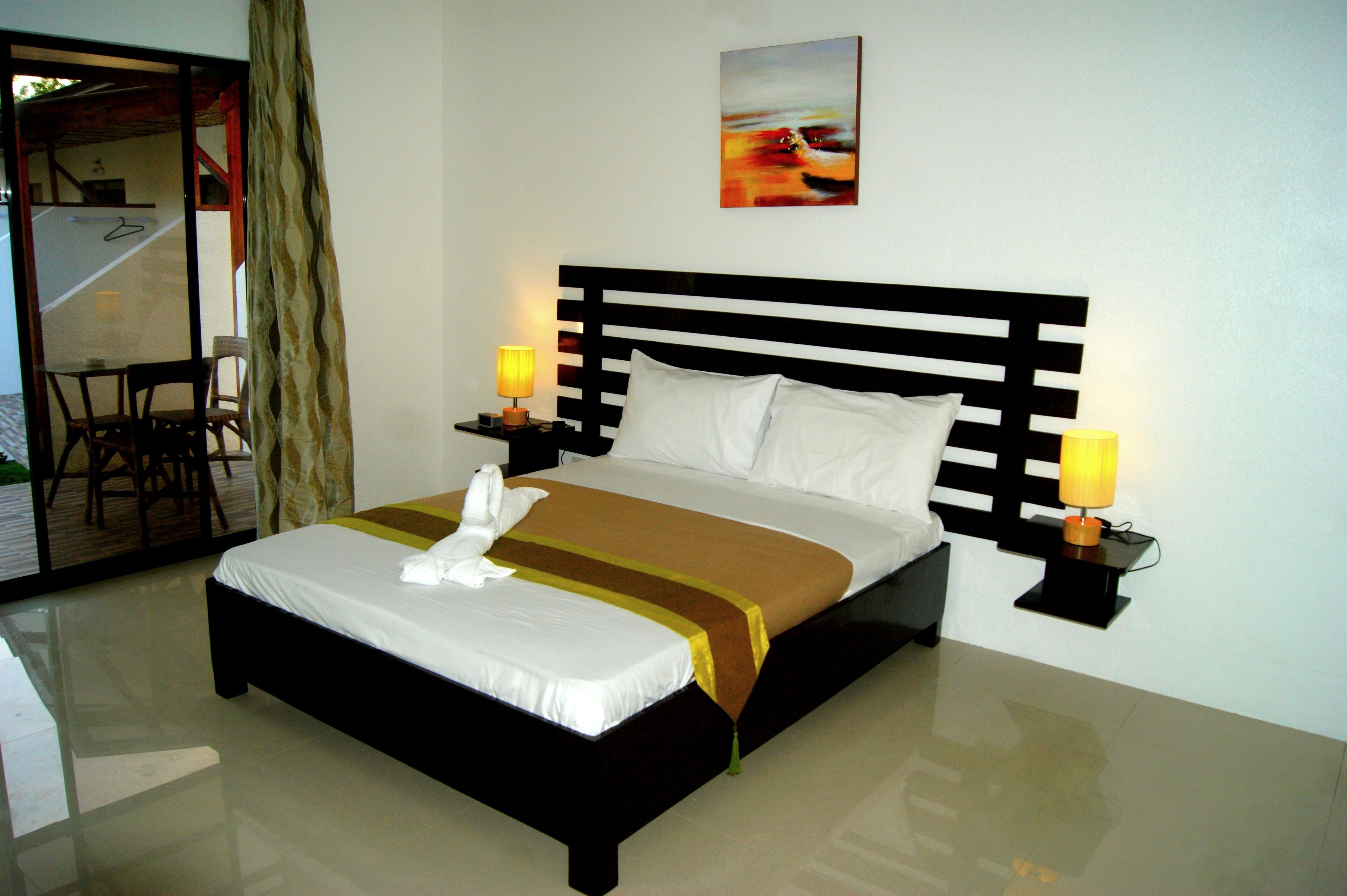 deluxe double room, 1 queen bed, accessible, pool view | minibar, in-room safe, desk, blackout curtains