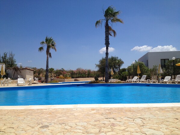 2 outdoor pools, pool umbrellas, pool loungers