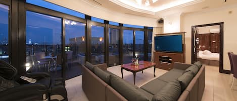 71sq m, Executive Suite, Non Smoking | Living area | 50-inch LCD TV with satellite channels, DVD player, first-run movies