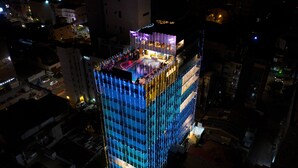 A high-rise building with a rooftop pool and multiple balconies. - Pearl Grand By Rathna (Colombo)