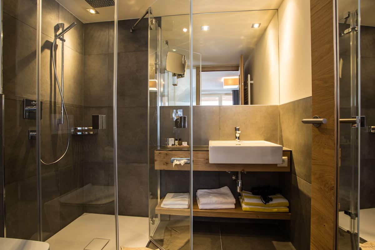 eco-friendly toiletries, hair dryer, bathrobes, towels