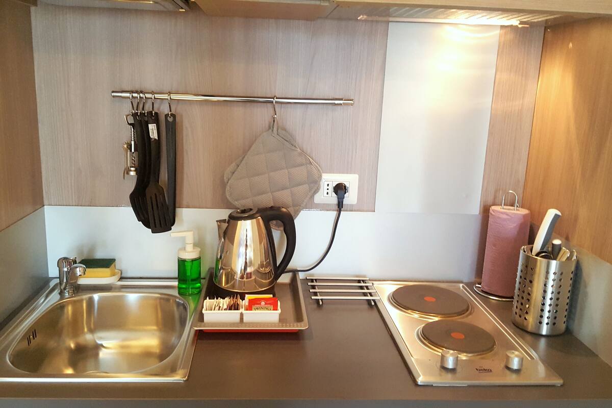 family room, kitchenette | private kitchenette | coffee/tea maker, electric kettle