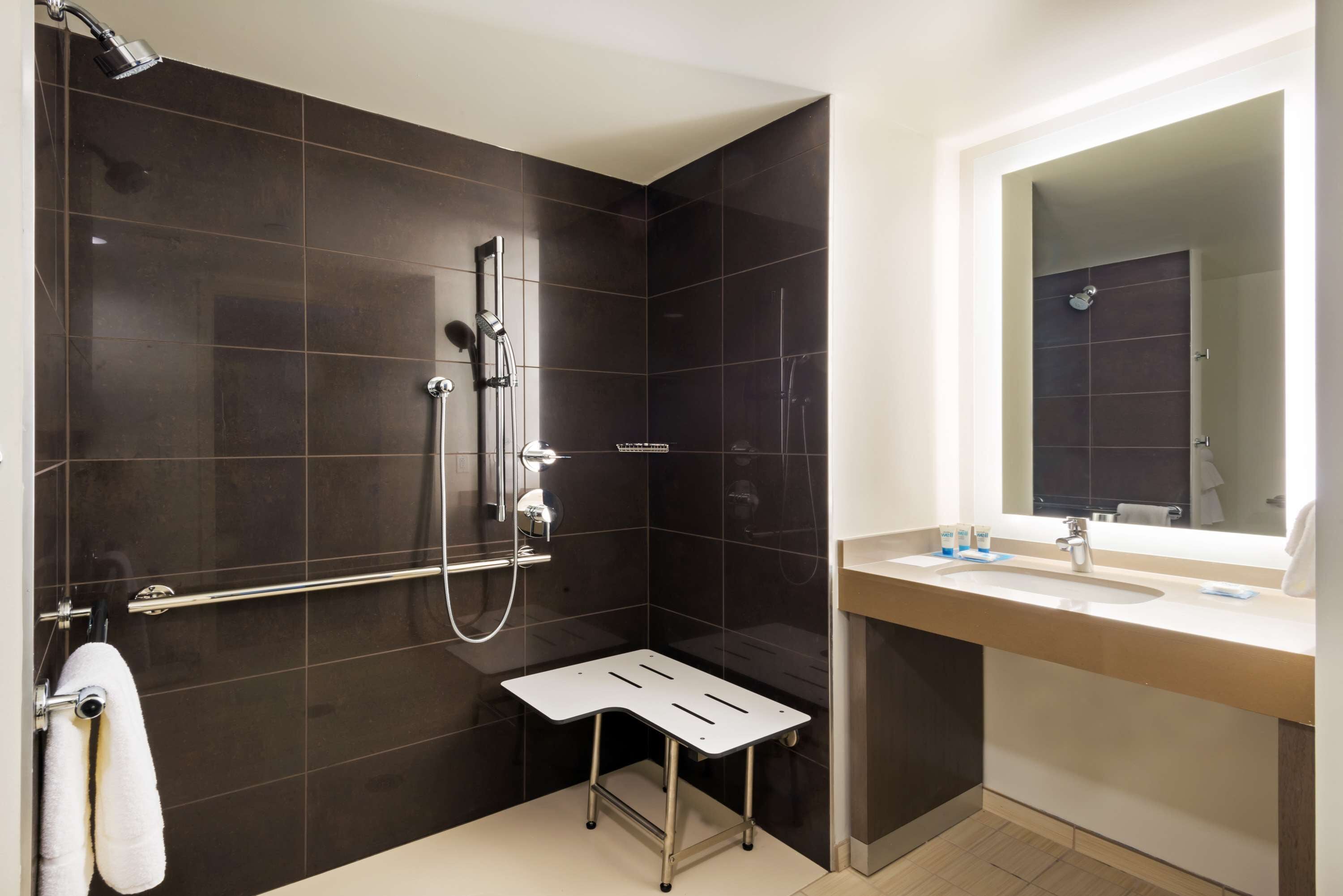 designer toiletries, hair dryer, towels, soap