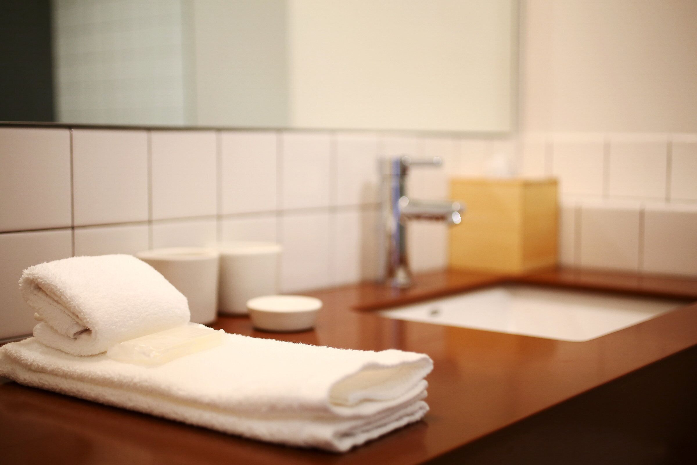 premium bedding, desk, blackout curtains, iron/ironing board