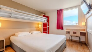 Premium bedding, desk, laptop workspace, blackout curtains