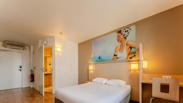 Premium bedding, desk, laptop workspace, blackout curtains