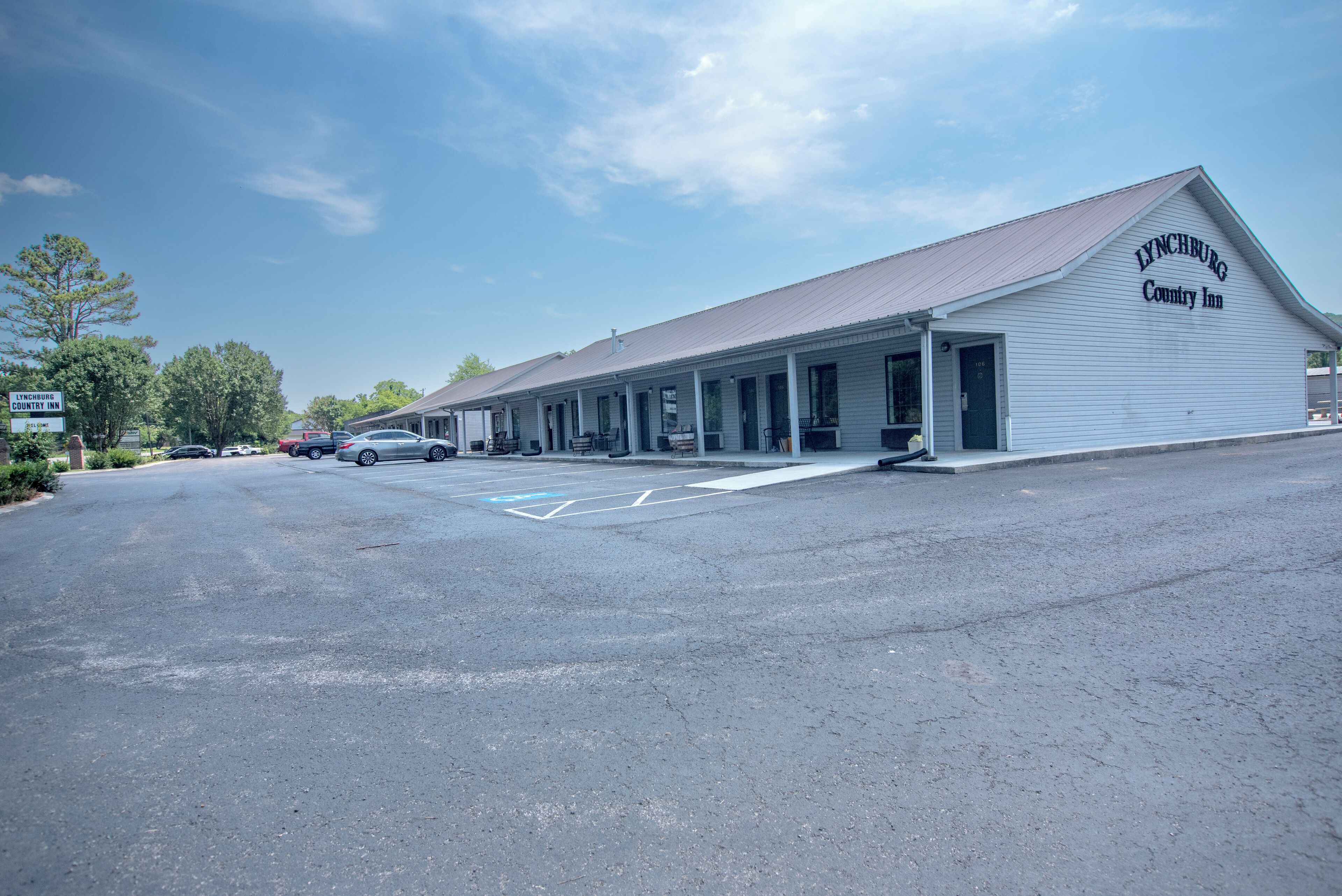 A white building with a sign reading "Lynchburg Country Inn."