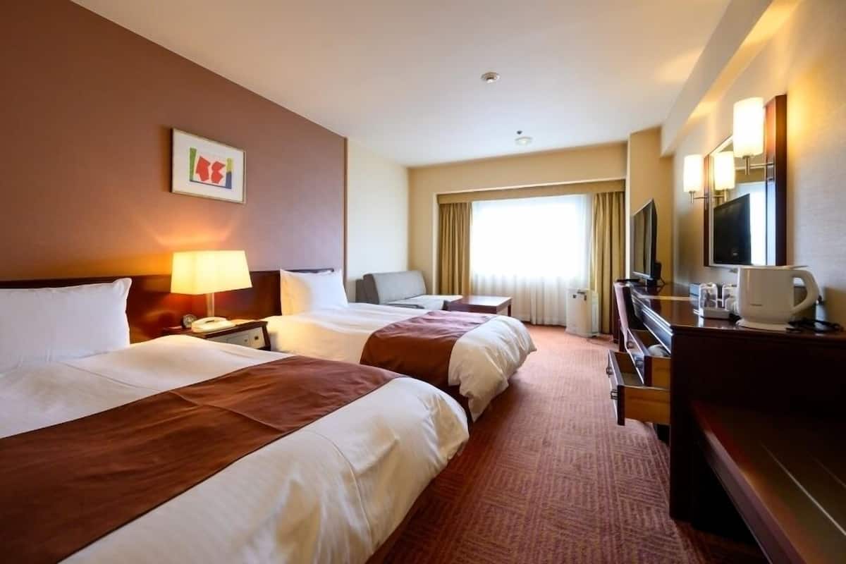 Standard Twin Room, Non Smoking (4F~8F) | Desk, blackout curtains, iron/ironing board, free WiFi