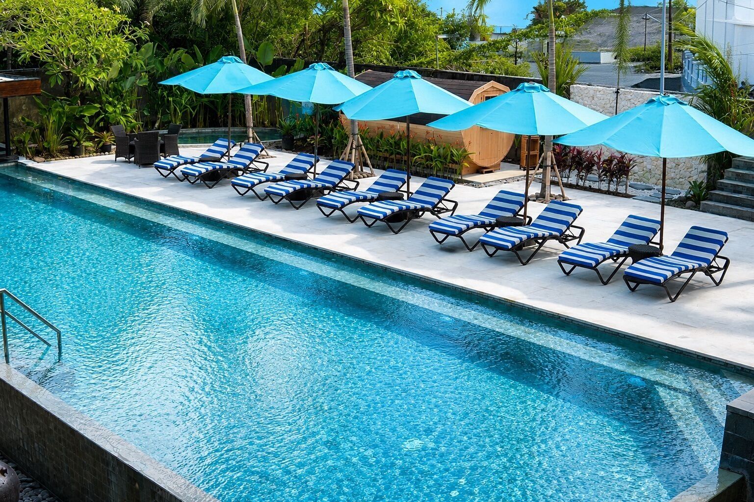 2 outdoor pools, open 7:30 AM to 8:00 PM, pool umbrellas, pool loungers