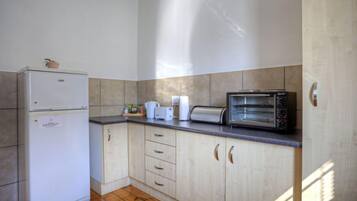 Standard Apartment, 2 Bedrooms (Upstairs) | Private kitchen | Full-sized fridge, microwave, stovetop, coffee/tea maker