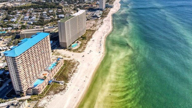A coastal hotel with a pool, beachfront access, and a view of the ocean. - Coastal Condo 707 by Brightwild Beachfront (Panama City Beach)