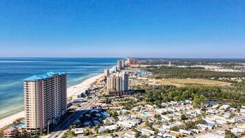 A coastal area with high-rise hotels, a beach, and a residential zone with mobile homes.