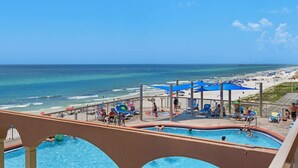 A pool area with a view of the beach and ocean. - Coastal Condo 807 by Brightwild Beachfront (Panama City Beach)