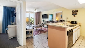 A compact hotel room with a kitchenette, a dining area, and a bathroom. - The Exuma Cay by Brightwild Pool View Parking (Key West)