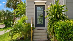 A house with a dark front door, a small porch, and a number '311B' on the wall. - NEW Soho Oasis - Stunning Home In Heart of Soho (Tampa)