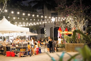 Experience the vibrant atmosphere of our outdoor market, where local vendors offer a variety of goods and activities.