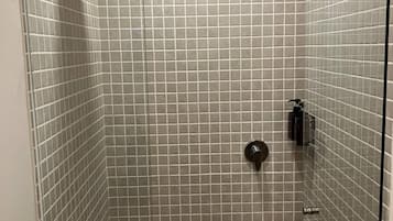 Shower, towels, soap, toilet paper