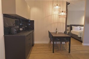 Enjoy a compact living space with a kitchenette, dining area, and cozy bedroom.