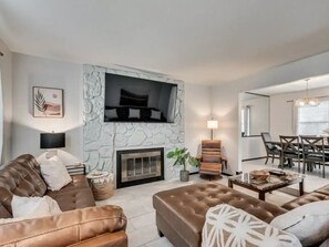 Smart TV, fireplace, books, offices