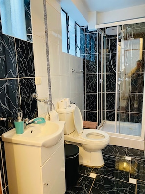 Shower, hair dryer, towels, soap