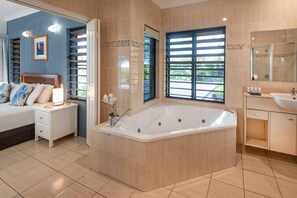 Jetted bath, hair dryer, towels, shampoo